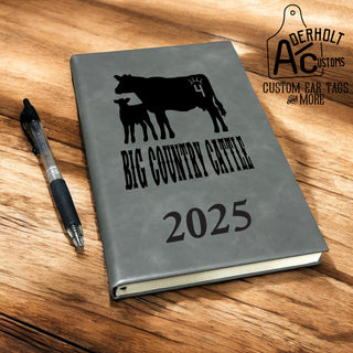 Custom faux leather journal in rich gray with a branded cow and calf logo custom engraved